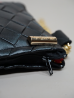 Pochette Miny noir et orange – Élégance artisanale | The Mad Shop